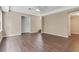 Open concept living area with hardwood floors, neutral walls, and natural light at 2073 Woodside Park Dr, Woodstock, GA 30188