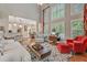Open-concept living area with lots of natural light, fireplace and access to kitchen and dining at 2073 Woodside Park Dr, Woodstock, GA 30188