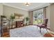 Bright office space with large windows, hardwood floors, and ample natural light at 2073 Woodside Park Dr, Woodstock, GA 30188