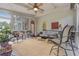 Covered porch with wicker furniture, a ceiling fan, and a view of the backyard at 2073 Woodside Park Dr, Woodstock, GA 30188