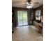 Dining room featuring tile flooring, wooden walls and decorative accents plus backyard access at 36 Mount Tabor Rd, Covington, GA 30014