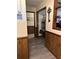 Hallway with decorative wood paneling on the lower portion of the wall and stylish gray wood flooring at 36 Mount Tabor Rd, Covington, GA 30014