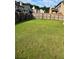 Large, well-maintained backyard with a lush lawn and privacy fence, perfect for outdoor activities and relaxation at 3897 Valley Bluff Ln, Snellville, GA 30039