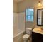 Bathroom featuring a shower-tub combo, large vanity, and tile flooring at 3897 Valley Bluff Ln, Snellville, GA 30039