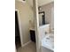 A modern bathroom featuring a vanity, tub, and tile accent wall at 3897 Valley Bluff Ln, Snellville, GA 30039