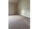 A neutral carpeted bedroom offers a blank canvas and peaceful atmosphere at 3897 Valley Bluff Ln, Snellville, GA 30039
