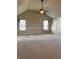 Spacious bonus room features carpet and windows for abundant natural light at 3897 Valley Bluff Ln, Snellville, GA 30039