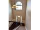 Grand foyer with chandelier, high ceilings, and staircase with iron railing at 3897 Valley Bluff Ln, Snellville, GA 30039
