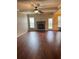 Inviting living room with hardwood floors, coffered ceiling, and stone fireplace at 3897 Valley Bluff Ln, Snellville, GA 30039