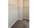 An organized walk-in closet equipped with shelving at 3897 Valley Bluff Ln, Snellville, GA 30039