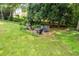 Backyard area with outdoor fire pit and seating at 635 Piping Rock Pt, Lawrenceville, GA 30043