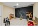 Finished basement featuring a chalkboard wall, tiled floors, and colorful decor at 635 Piping Rock Pt, Lawrenceville, GA 30043