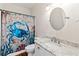 Charming bathroom with a crab-themed shower curtain, granite countertop, and modern fixtures at 635 Piping Rock Pt, Lawrenceville, GA 30043