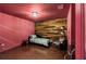 Bedroom with wooden accent wall and hardwood floors at 635 Piping Rock Pt, Lawrenceville, GA 30043