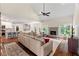 Inviting living room with a fireplace, hardwood floors, a vaulted ceiling, and an open layout to the kitchen at 635 Piping Rock Pt, Lawrenceville, GA 30043