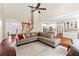 Open-concept living room with hardwood floors, staircase, and seamless transition to the kitchen at 635 Piping Rock Pt, Lawrenceville, GA 30043