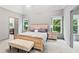 Spacious main bedroom with a seating area and a neutral color scheme at 635 Piping Rock Pt, Lawrenceville, GA 30043