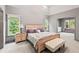 Spacious main bedroom with a seating area and a neutral color scheme at 635 Piping Rock Pt, Lawrenceville, GA 30043