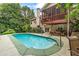 Back of house featuring a pool and a covered porch at 635 Piping Rock Pt, Lawrenceville, GA 30043