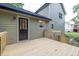 A wooden deck attached to the house with access to the backyard at 1111 Fieldgate Rd, Lawrenceville, GA 30044