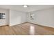 Bedroom with neutral walls, hardwood flooring, and view to the outdoors at 1111 Fieldgate Rd, Lawrenceville, GA 30044