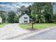 Street-side view of this two-story home featuring garage, neat landscaping, and a welcoming stone porch at 1111 Fieldgate Rd, Lawrenceville, GA 30044