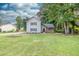 Inviting two-story home with a lush green lawn, beautiful landscaping, and cozy curb appeal at 1111 Fieldgate Rd, Lawrenceville, GA 30044