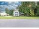 Charming two-story home with lush lawn and tasteful stone accents, blending modern comfort with natural beauty at 1111 Fieldgate Rd, Lawrenceville, GA 30044