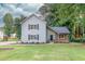 Charming two-story house with a stone-accented porch and a well-manicured lawn, all adding to its curb appeal at 1111 Fieldgate Rd, Lawrenceville, GA 30044