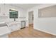 Updated kitchen featuring white cabinets, stainless steel appliances, granite counters, and hardwood flooring at 1111 Fieldgate Rd, Lawrenceville, GA 30044