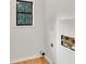A compact laundry area with a window that offers natural light, and utility connections at 1111 Fieldgate Rd, Lawrenceville, GA 30044