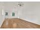 Bright living room featuring hardwood floors, white walls, and large windows offering ample natural light at 1111 Fieldgate Rd, Lawrenceville, GA 30044