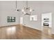 Bright living room featuring hardwood floors, white walls, and large windows offering ample natural light at 1111 Fieldgate Rd, Lawrenceville, GA 30044
