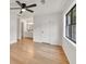 A spacious main bedroom boasts hardwood floors, a ceiling fan, and a full ensuite bathroom at 1111 Fieldgate Rd, Lawrenceville, GA 30044