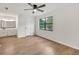 A light-filled main bedroom includes hardwood floors, a ceiling fan, and ensuite bathroom at 1111 Fieldgate Rd, Lawrenceville, GA 30044