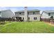Expansive backyard with lush lawn, privacy fence, and a cozy patio, ideal for outdoor enjoyment at 143 Monarch Way, Hiram, GA 30141