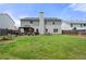 Large backyard with green grass, a patio, and a full privacy fence to create a relaxing outdoor oasis at 143 Monarch Way, Hiram, GA 30141