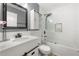 Bathroom with white subway tile, glass shower door and modern vanity at 143 Monarch Way, Hiram, GA 30141