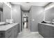 Bright bathroom with double sink vanities, marble floors, and a bedroom view at 143 Monarch Way, Hiram, GA 30141