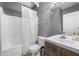 Bathroom with shower and tub combination, features wooden vanity with silver fixtures at 143 Monarch Way, Hiram, GA 30141