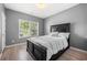 Bedroom with a queen bed and an outside view from the window at 143 Monarch Way, Hiram, GA 30141