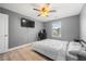 Bedroom featuring hardwood floors, desk and television at 143 Monarch Way, Hiram, GA 30141