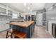 Gourmet kitchen featuring a large island, stainless steel appliances, and custom cabinetry at 143 Monarch Way, Hiram, GA 30141