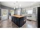 Spacious kitchen with a butcher block island, stainless steel appliances, and ample cabinet space at 143 Monarch Way, Hiram, GA 30141