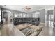Open-concept living room with a large sectional, neutral colors, and lots of space at 143 Monarch Way, Hiram, GA 30141