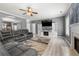 Living room boasts hardwood floors, fireplace, and gray furniture and walls at 143 Monarch Way, Hiram, GA 30141