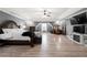 Spacious main bedroom features a tray ceiling, hardwood floors, and a sitting area near the fireplace at 143 Monarch Way, Hiram, GA 30141