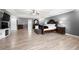The main bedroom has wood floors, a tray ceiling, and plenty of room for dressers and a seating area at 143 Monarch Way, Hiram, GA 30141