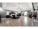 Spacious primary bedroom with a ceiling fan, hardwood floors, and neutral colored walls at 143 Monarch Way, Hiram, GA 30141