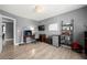 Home office with a desk, shelves, hardwood floors, and a mini fridge at 143 Monarch Way, Hiram, GA 30141